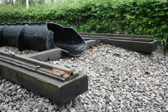 The surviving 1840s atmospheric railway pipe and broad gauge track, at Didcot Railway Centre